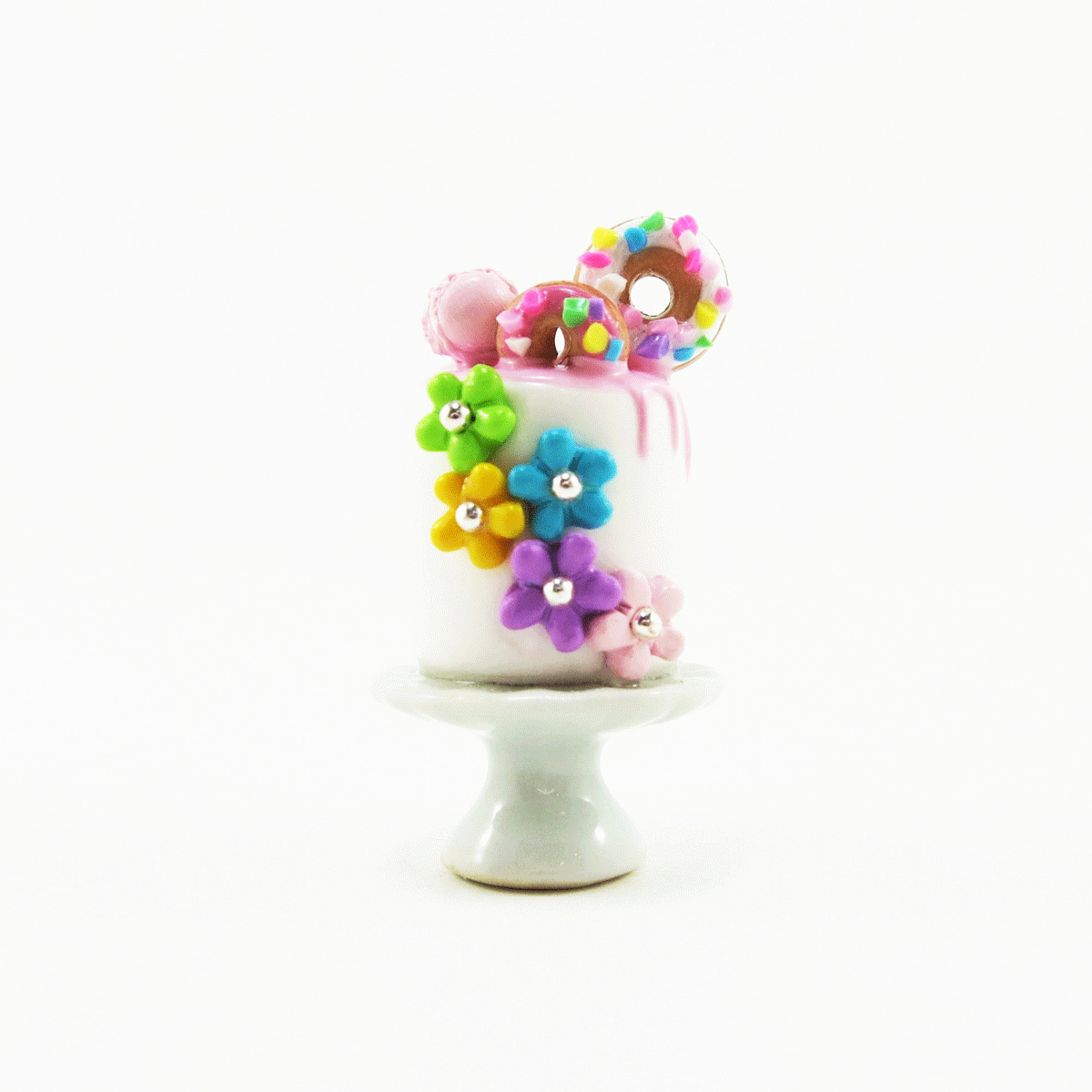 Gâteau fleuri multicolore avec beignes & macaron sur le dessus - Pièce unique