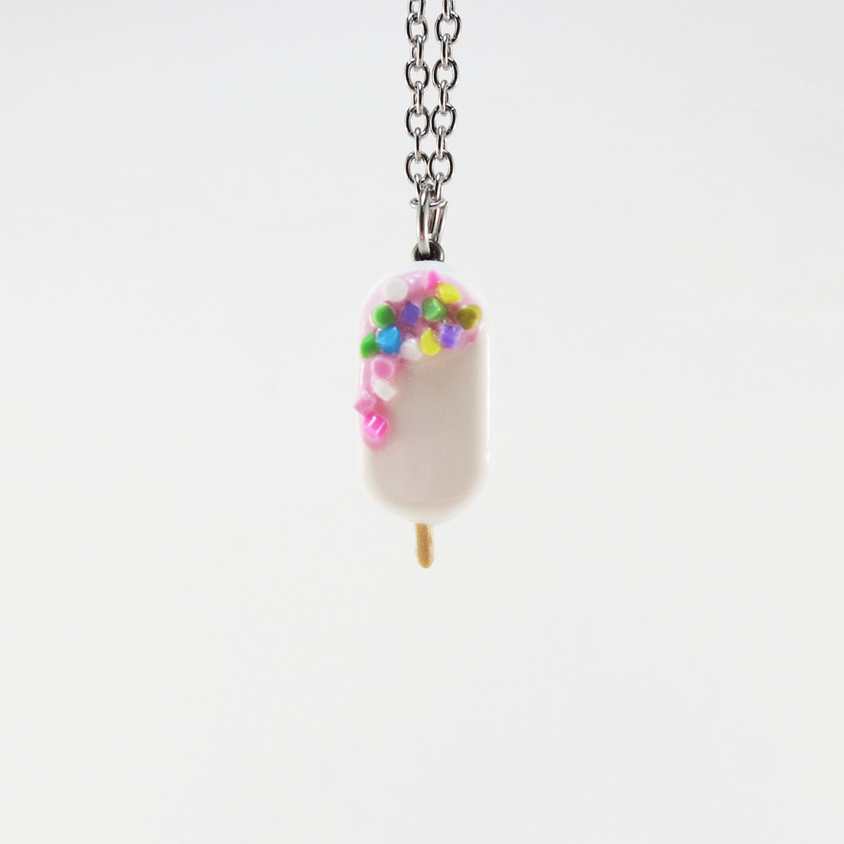 Popsicle blanc, crémage rose ultra pâle & confettis multicolores